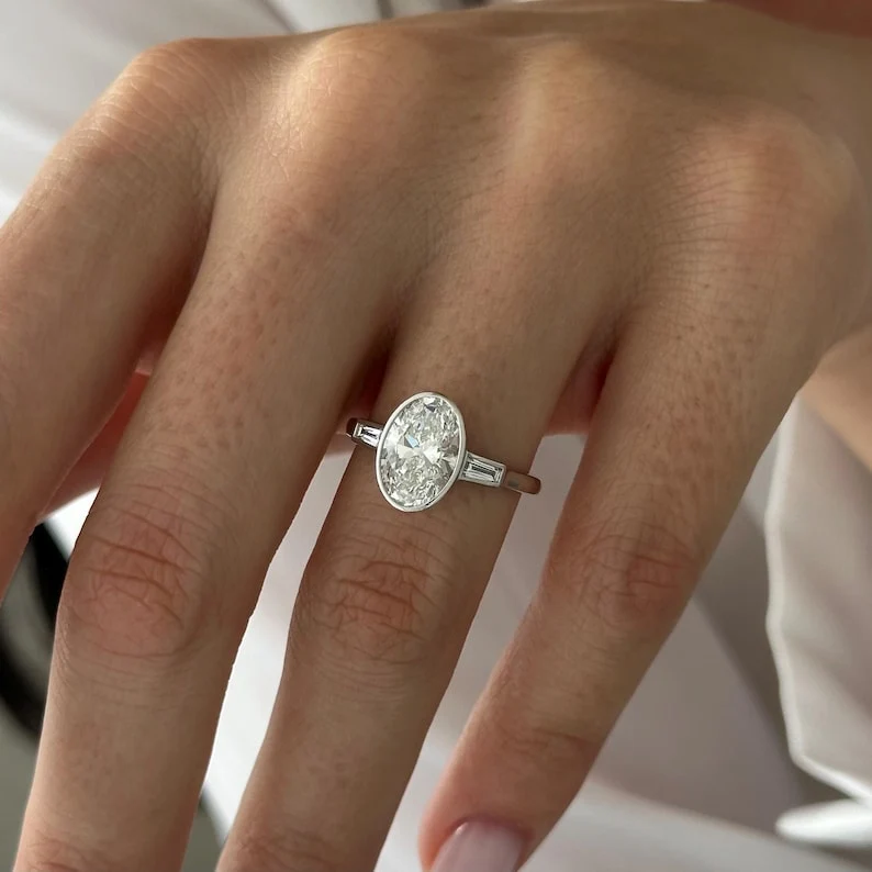 2 CT Oval Bezel and Three Stone Lab Grown Diamond Engagement Ring preview angle 1