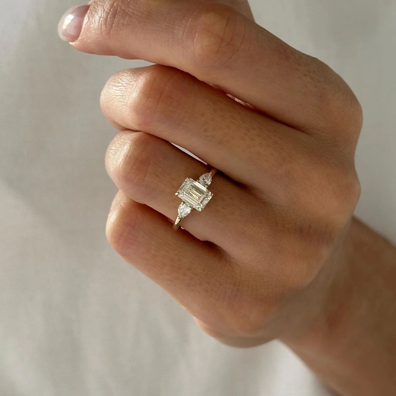 1.5 CT Emerald Three Stone Lab Grown Diamond Engagement Ring preview angle 3