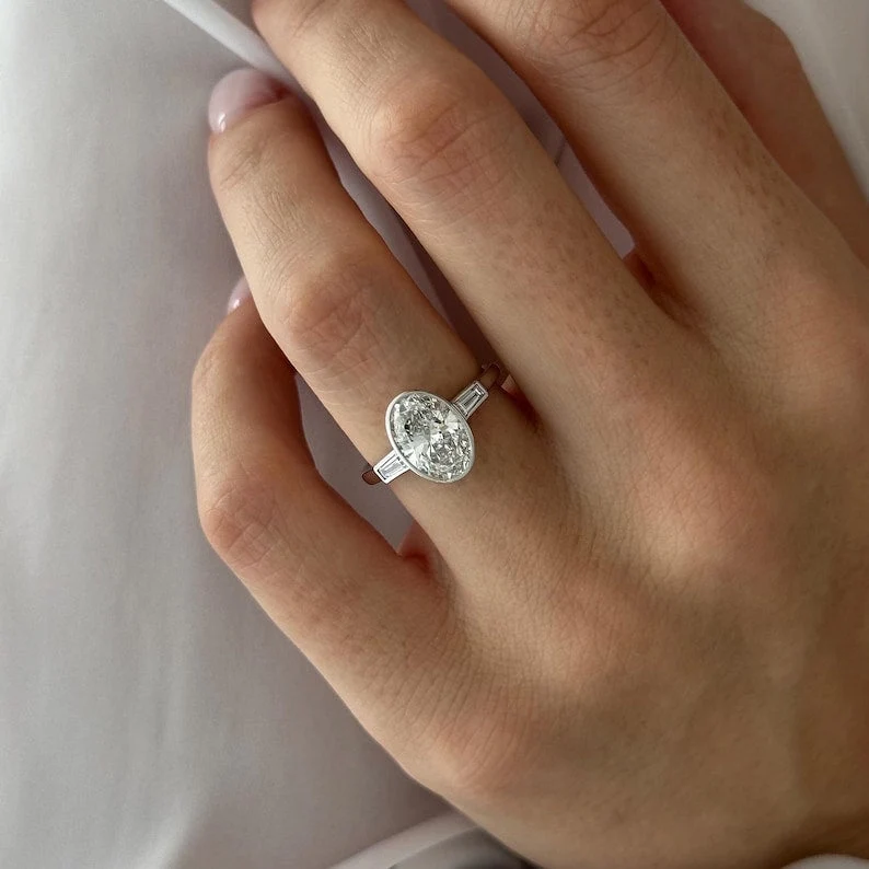 2 CT Oval Bezel and Three Stone Lab Grown Diamond Engagement Ring preview angle 3